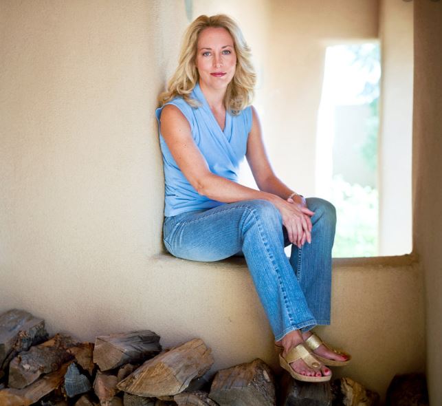 Valerie Plame on a beach in a bikini